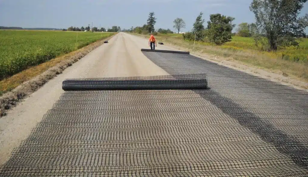 Geogrid installation for reinforcing pavements