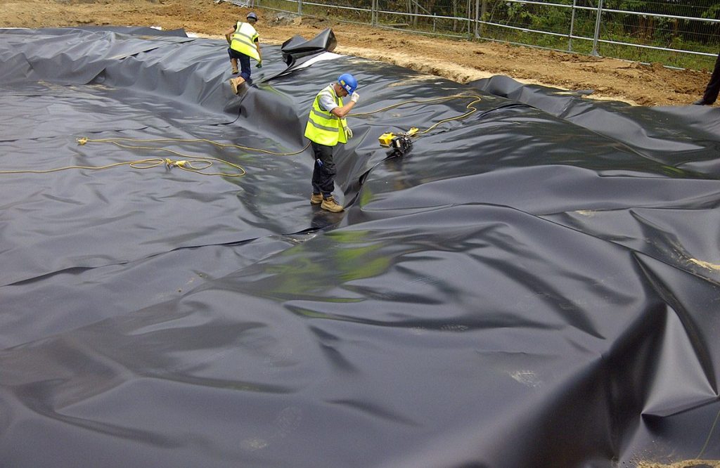 Geotextile pond underlayment installed beneath pond liner for pond construction and liner protection