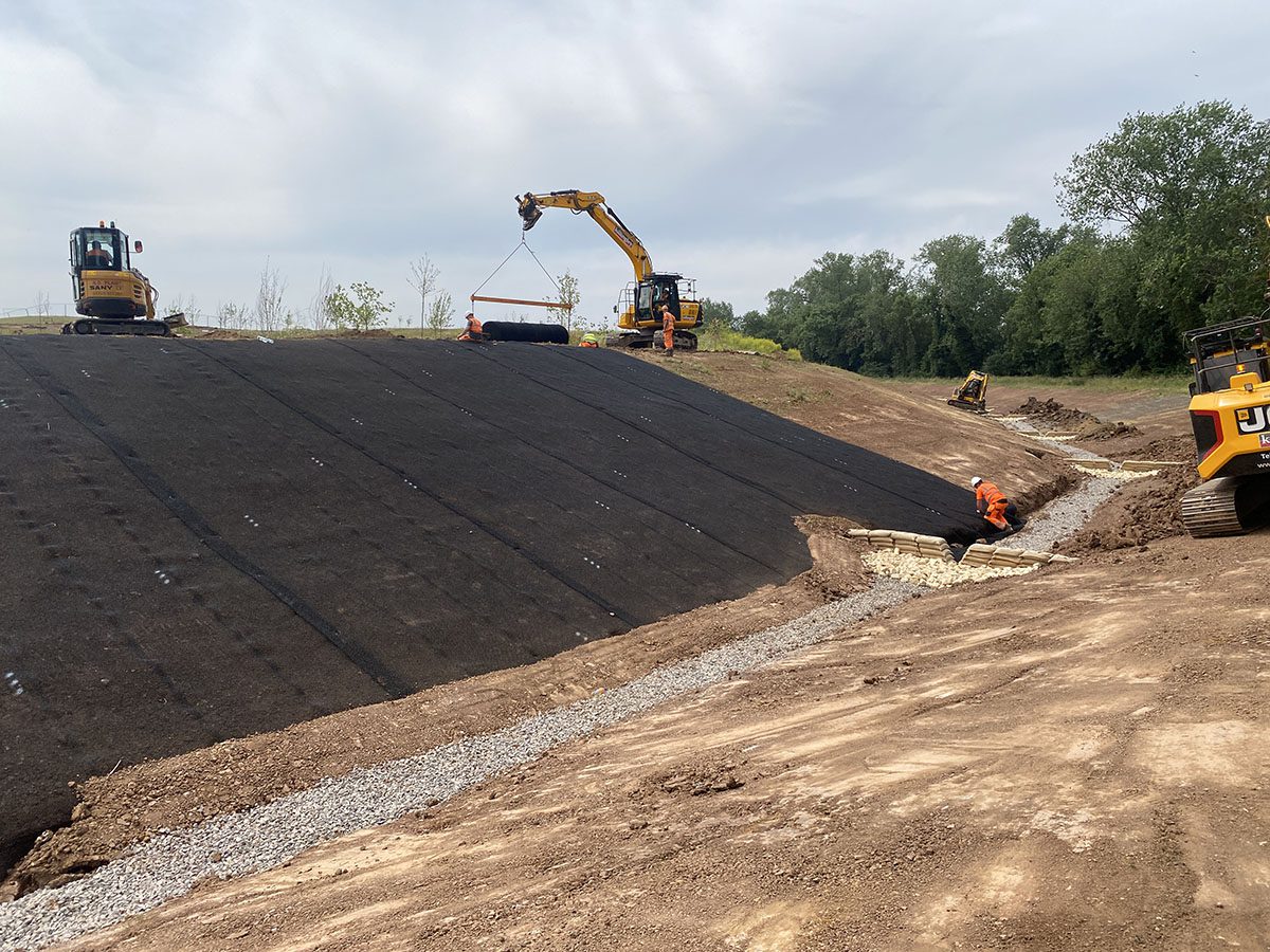 Slope stabilization project using geocomposite subsoil drain for subsurface drainage