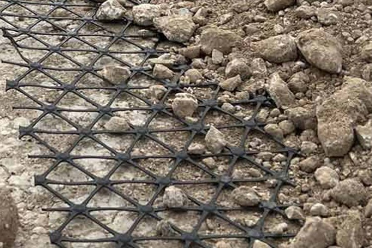 Triaxial Geogrid installed in road construction for base stabilization and load distribution improvement