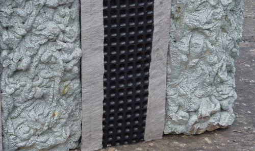Geocomposite wall drain system installed behind a retaining wall during construction