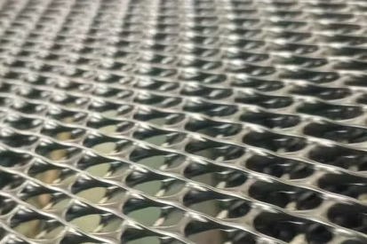 HDPE geonet rolls stacked for shipment at a geosynthetics production facility