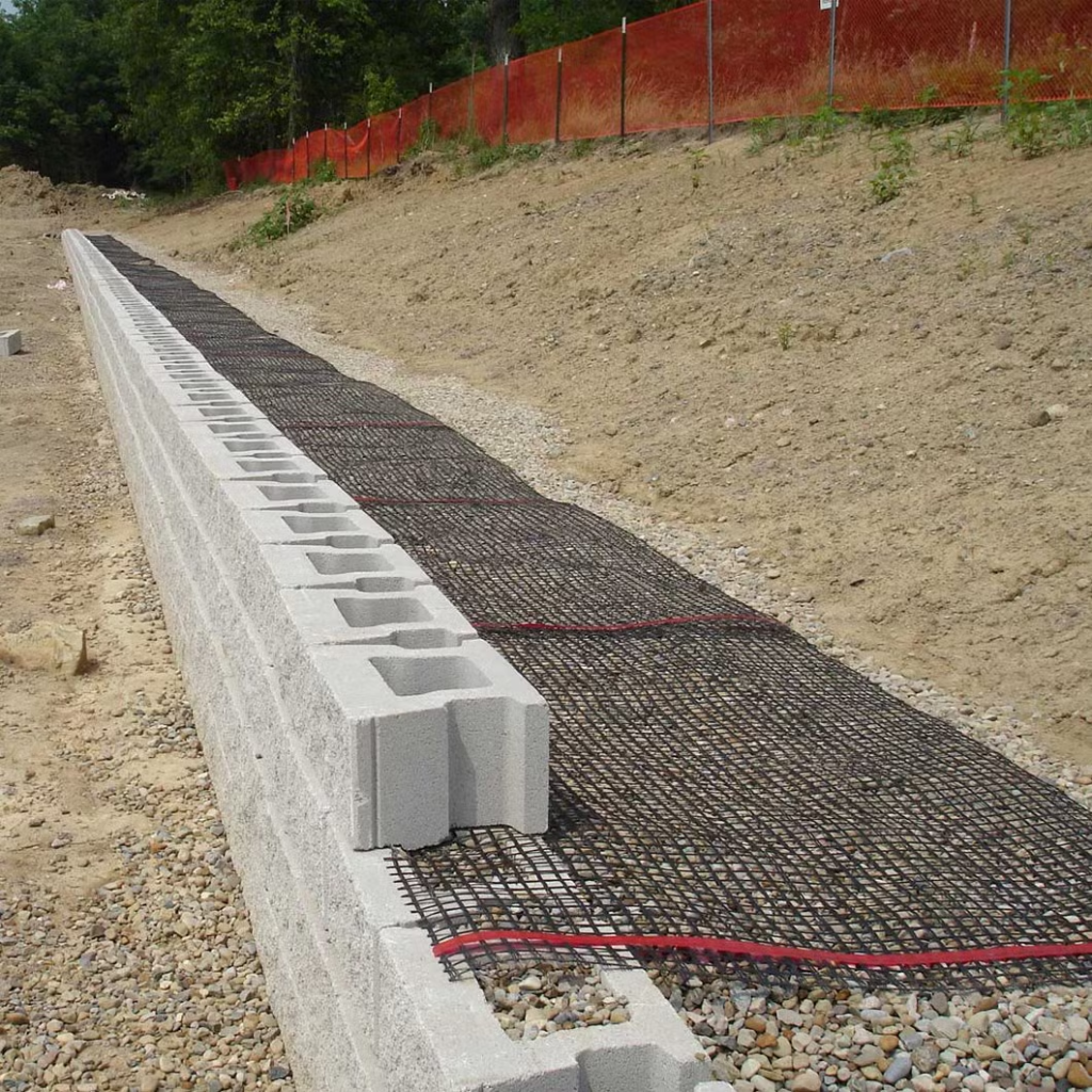 Installation of geogrid fabric for retaining wall reinforcement

