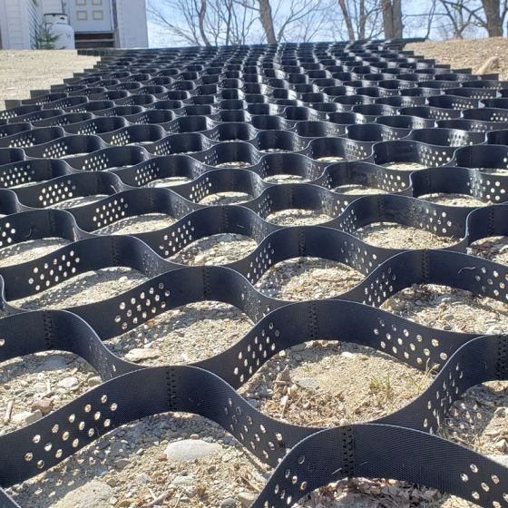 Geo grid ground grid installation for soil stabilization and road construction