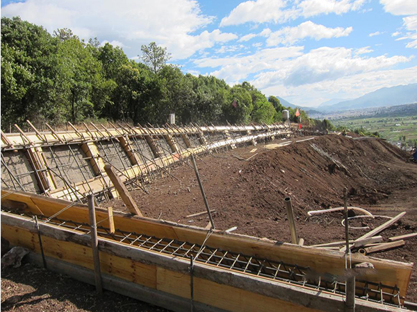 geosynthetic reinforcement slope stabilization project with geocell installation