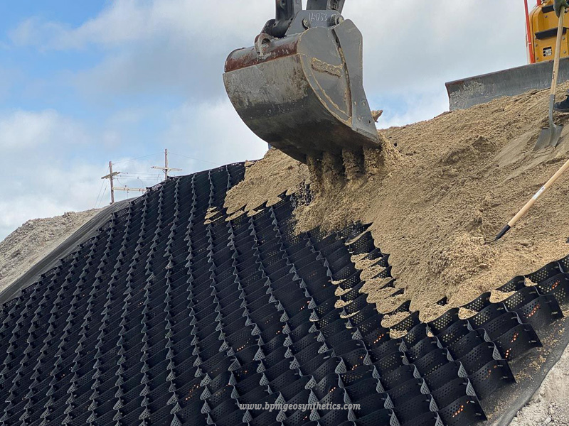 Geocell driveway system with crushed gravel for unpaved road construction