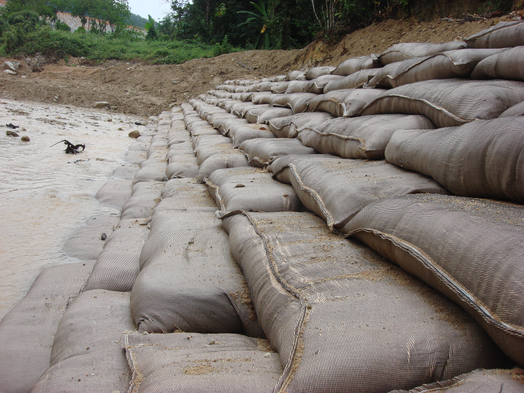 River regulation engineering project with geotextile bags for riverbank stabilization