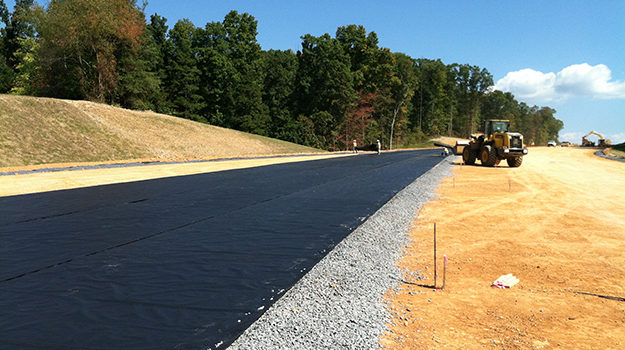 Road construction using non woven geotextiles for soil separation and drainage improvement