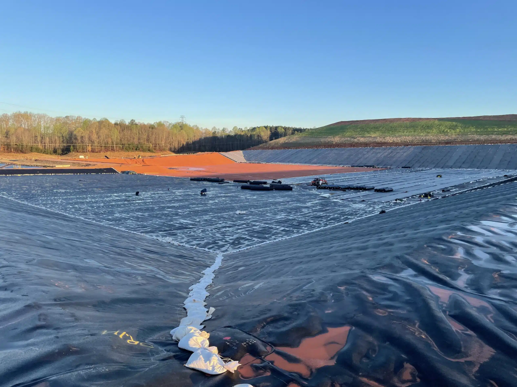 Geosynthetic liner used in a waste containment and landfill enclosure project