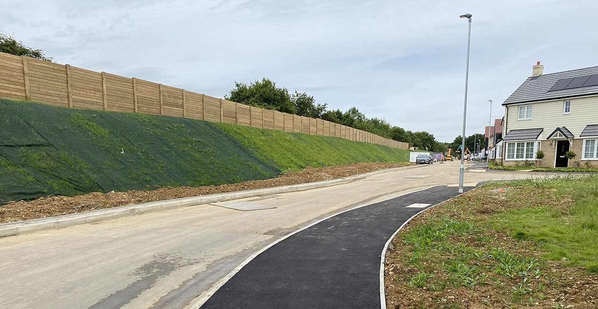 Geosynthetic reinforcement retaining wall construction project with reinforced soil system