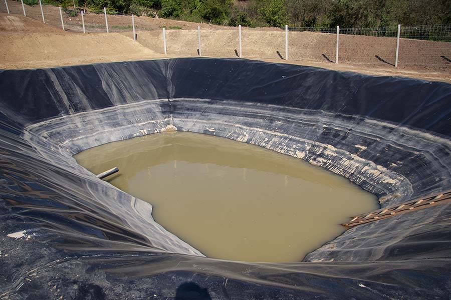 Hydraulic project showing geosynthetics installation with geomembrane and geotextile for water containment and protection