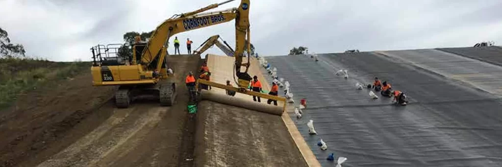 Geotextile erosion control system for drainage and vegetation growth